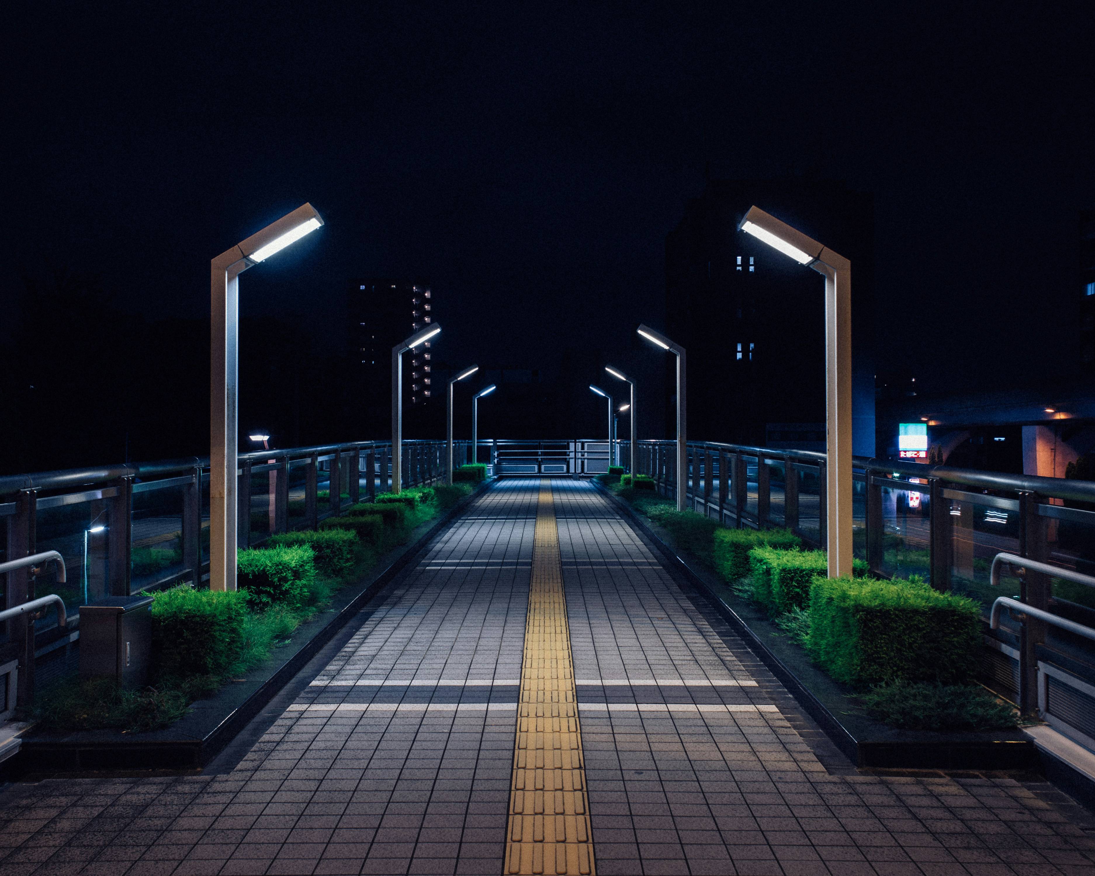 gray concrete road during night time
