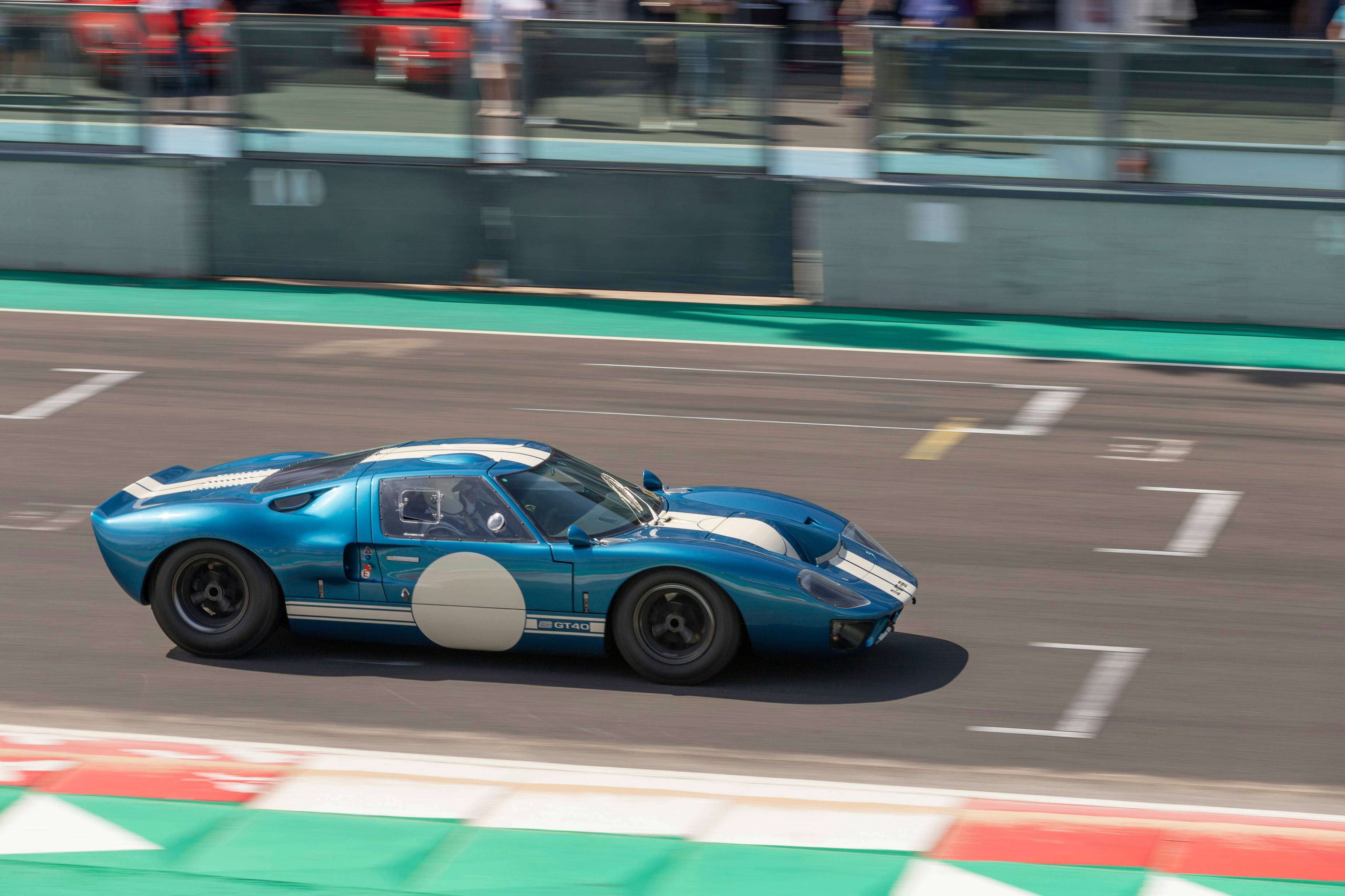 blue porsche 911 on road during daytime