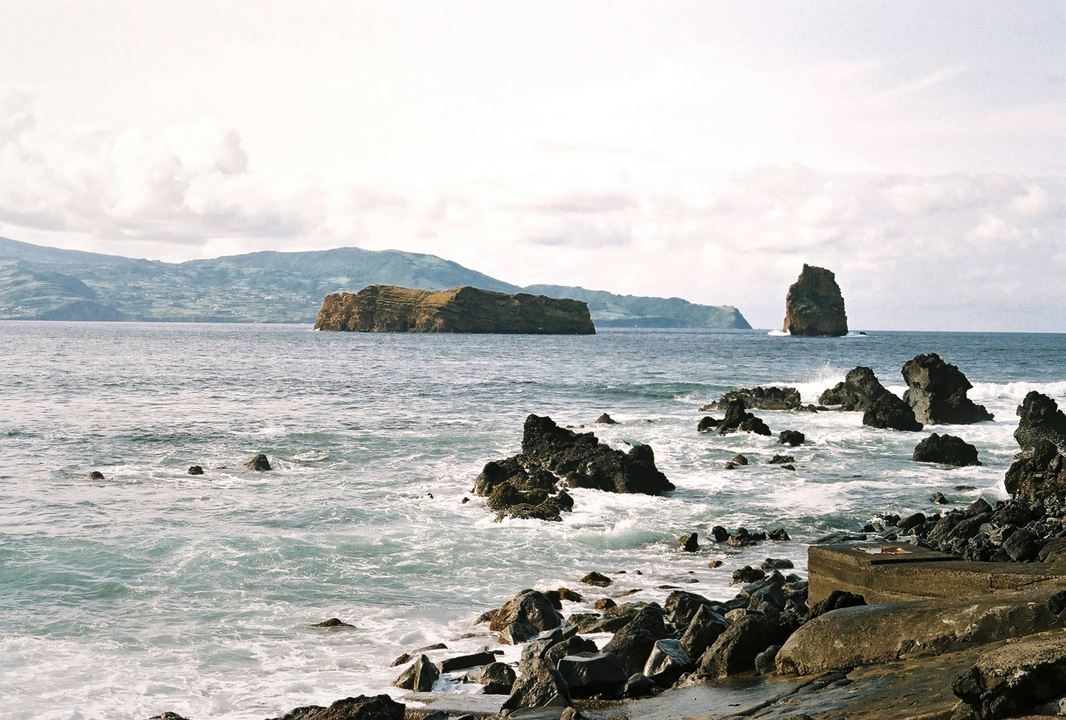 a large body of water surrounded by rocks